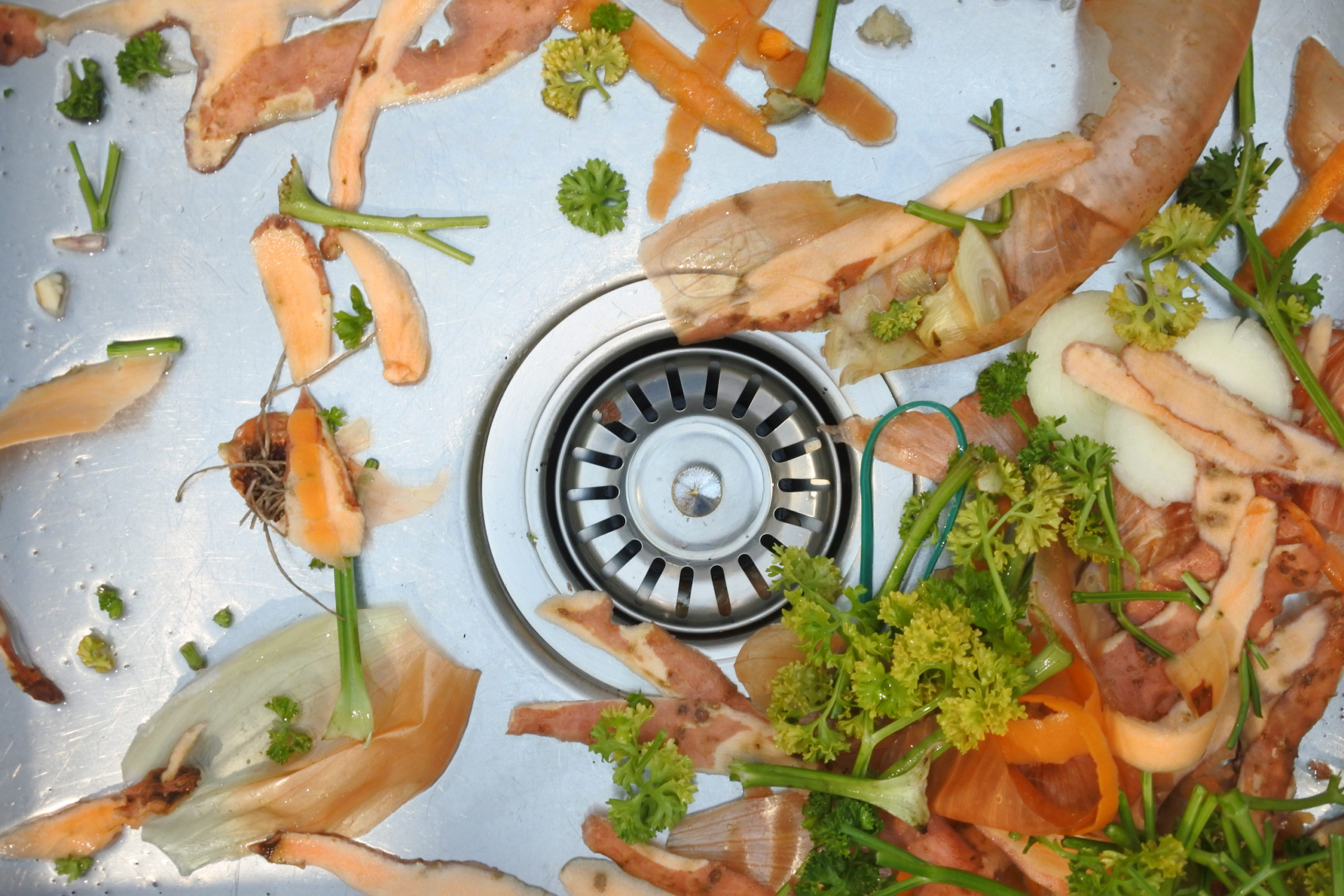Mix of vegetables waste in home kitchen sink